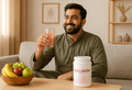 Pakistani man holding collagen supplement with collagen benefits for dark circles and skin health.