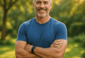 Middle-aged man enjoying an active and healthy lifestyle in a sunlit garden, representing the benefits of magnesium glycinate for bone and muscle health.