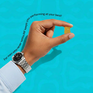 Hand holding a yellow supplement capsule with text on a blue background
